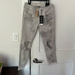 Grey washed, distressed stretch jeans from American eagle. Size 6.